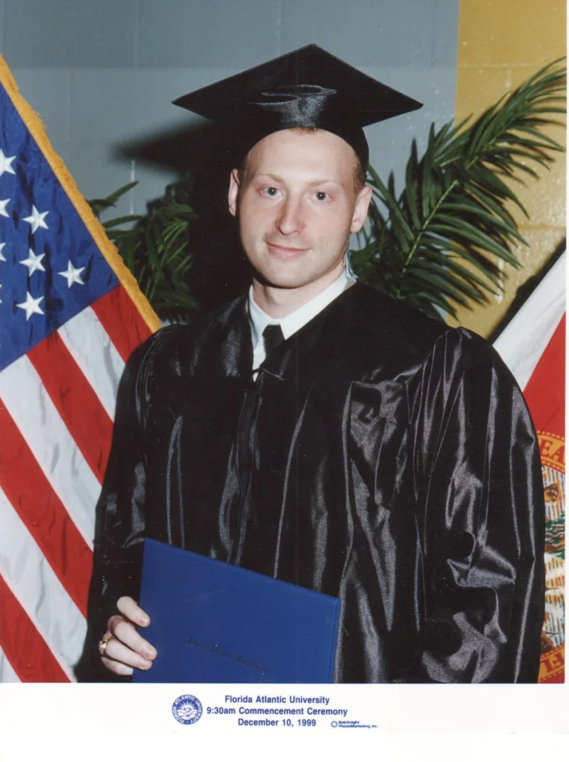 George Ackerman in cap and gown at the Florida Atlantic University commencement, December 1999